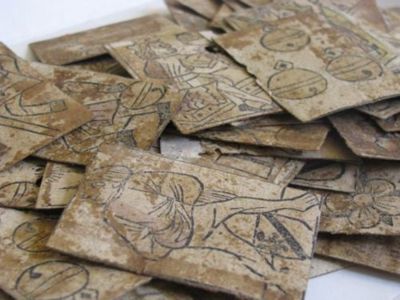 Small light brown cards in a pile